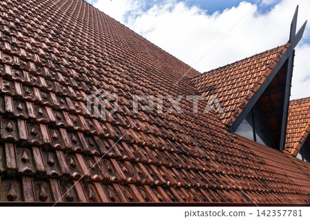 Angled view of terracotta roof tiles on a traditional building, Vietnam Angled view of terracotta roof tiles on a traditional building, Vietnam 142357781