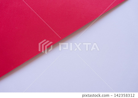 Overlapping white and red construction paper 142358312