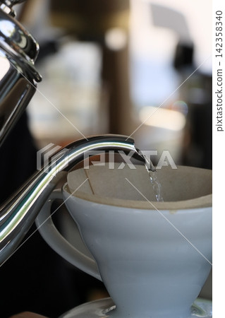 Drip coffee carefully brewed cup by cup Drip coffee carefully brewed cup by cup 142358340