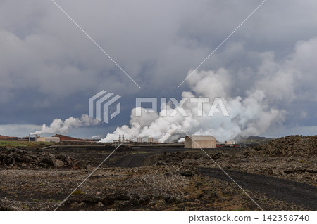 Broad white steam plume drifting across black volcanic terrain, Reykjanes Power Plant, Iceland Broad white steam plume drifting across black volcanic terrain, Reykjanes Power Plant, Iceland 142358740