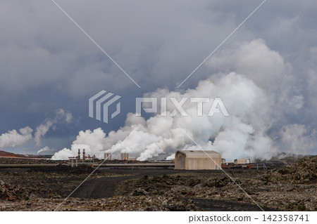 Pale vapor plume rising beyond black lava under low cloud, Reykjanes Power Plant, Iceland Pale vapor plume rising beyond black lava under low cloud, Reykjanes Power Plant, Iceland 142358741