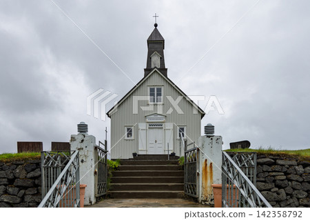 Strandarkirkja church facing a central stair and wrought entrance gate, Selvogur, Iceland 142358792
