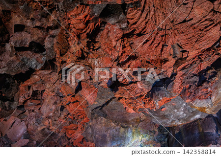 Cooled lava preserving red ripples from a cooled volcanic flow, Raufarholshellir, Iceland Cooled lava preserving red ripples from a cooled volcanic flow, Raufarholshellir, Iceland 142358814