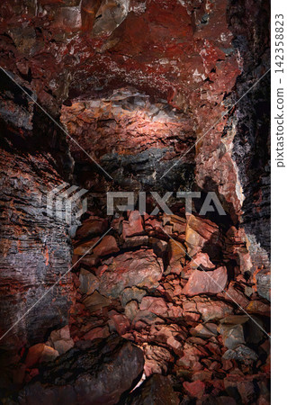 Cooled lava with an upright rock mass isolated by shadow, Raufarholshellir, Iceland Cooled lava with an upright rock mass isolated by shadow, Raufarholshellir, Iceland 142358823