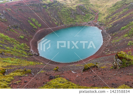 Kerid crater, Iceland, in diffuse afternoon light during rainy overcast conditions Kerid crater, Iceland, in diffuse afternoon light during rainy overcast conditions 142358834