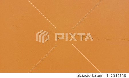 Textured orange wall surface with fine cracks. Textured orange wall surface with fine cracks. 142359138