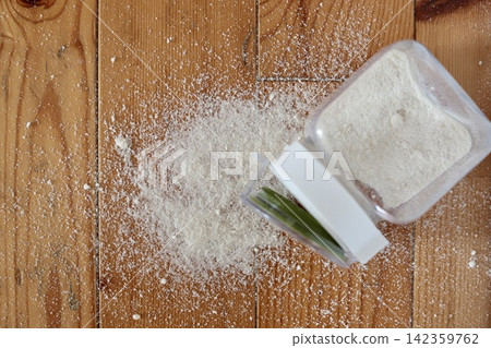Chicken stock powder and seasonings that were dropped and scattered on the flooring. Chicken stock powder and seasonings that were dropped and scattered on the flooring. 142359762