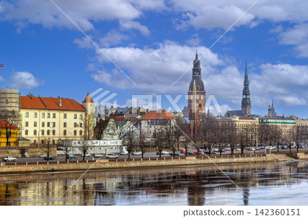 Daylight panoramic view of Old Riga city skyline from Daugava river, Latvia. Historic church spires and medieval buildings Daylight panoramic view of Old Riga city skyline from Daugava river, Latvia. Historic church spires and medieval buildings 142360151