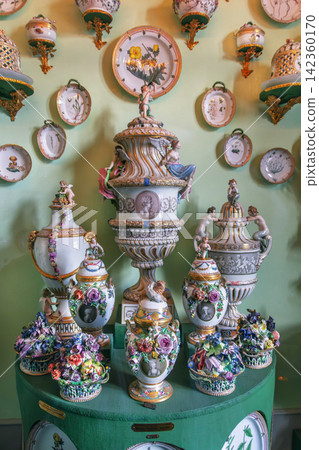 Set of royal porcelain tableware in Rosenborg Castle, Copenhagen, Denmark Set of royal porcelain tableware in Rosenborg Castle, Copenhagen, Denmark 142360170