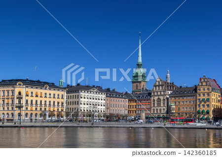 View of Kornhamnstorg square and old town colorful buildings from the water in Stockholm, Sweden. Clear blue sky in April View of Kornhamnstorg square and old town colorful buildings from the water in Stockholm, Sweden. Clear blue sky in April 142360185