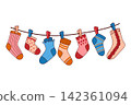 Colorful different hand knitted socks hang on a rope secured with a clothespin.Cozy wool and cotton socks and knee-highs are dried on a clothesline 142361094