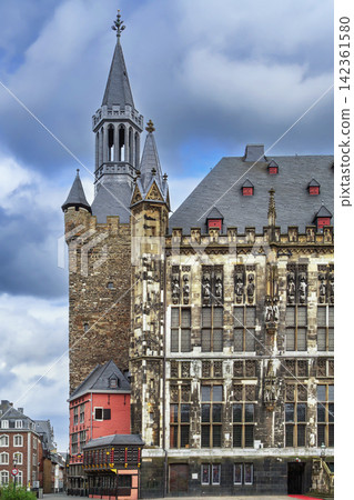 Aachen Rathaus facade with Granusturm tower and Postwagen restaurant in Aachen Germany. Gothic architecture exterior view Aachen Rathaus facade with Granusturm tower and Postwagen restaurant in Aachen Germany. Gothic architecture exterior view 142361580