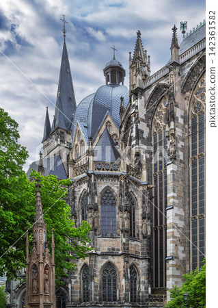 Aachen Cathedral tower and dome view in Aachen Germany. Close up of historic gothic and carolingian architecture Aachen Cathedral tower and dome view in Aachen Germany. Close up of historic gothic and carolingian architecture 142361582