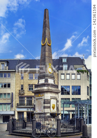 Obelisk on the market square at Old City Hall of Bonn Germany. Close up view of historic baroque monument architecture Obelisk on the market square at Old City Hall of Bonn Germany. Close up view of historic baroque monument architecture 142361594