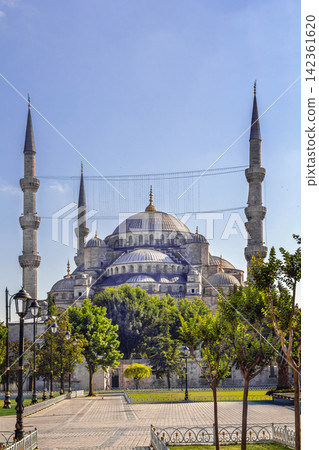 Sultan Ahmed Mosque view from Sultanahmet Square in Istanbul, Turkey. Classic Ottoman architecture with domes under blue sky Sultan Ahmed Mosque view from Sultanahmet Square in Istanbul, Turkey. Classic Ottoman architecture with domes under blue sky 142361620