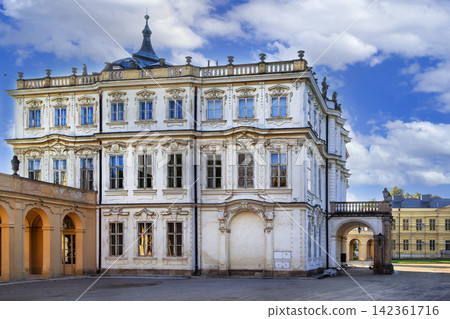 Ploskovice Castle, Czech Republic. Side view of historic Baroque palace building under clear sky in bright daylight Ploskovice Castle, Czech Republic. Side view of historic Baroque palace building under clear sky in bright daylight 142361716