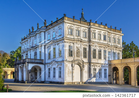 Ploskovice Castle, Czech Republic. Side view of Baroque palace facade under clear sky in bright daylight. Ploskovice Castle, Czech Republic. Side view of Baroque palace facade under clear sky in bright daylight. 142361717