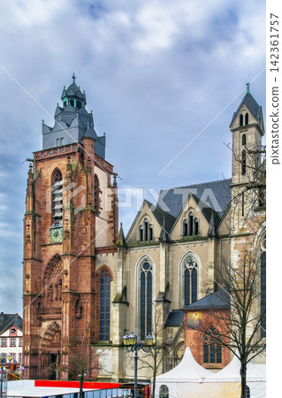 Wetzlar Cathedral with red sandstone tower in Germany. Ancient religious architecture under cloudy sky and no people around Wetzlar Cathedral with red sandstone tower in Germany. Ancient religious architecture under cloudy sky and no people around 142361757
