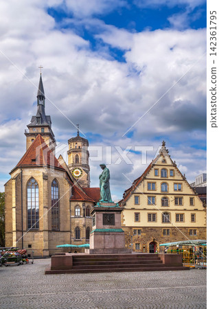 View of Schillerplatz square with Schiller monument in Stuttgart, Germany. Historical city center under cloudy sky and clouds View of Schillerplatz square with Schiller monument in Stuttgart, Germany. Historical city center under cloudy sky and clouds 142361795