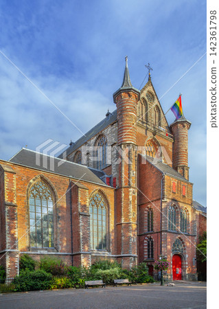 Facade of Pieterskerk church in Leiden, Netherlands. Gothic architecture of the historical monument under cloudy sky Facade of Pieterskerk church in Leiden, Netherlands. Gothic architecture of the historical monument under cloudy sky 142361798