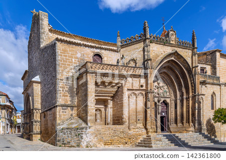 Portal of San Pablo Church in Ubeda, Spain. Medieval architecture with Gothic and Romanesque details under cloudy sky in daytime Portal of San Pablo Church in Ubeda, Spain. Medieval architecture with Gothic and Romanesque details under cloudy sky in daytime 142361800