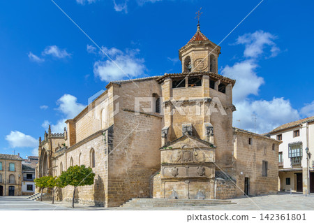 Apse view of San Pablo Church in Ubeda, Spain. Medieval stone architecture under partly cloudy sky at daytime Apse view of San Pablo Church in Ubeda, Spain. Medieval stone architecture under partly cloudy sky at daytime 142361801