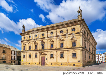 Facade of Vazquez de Molina Palace in Ubeda, Spain. Renaissance architecture under partly cloudy sky at daytime Facade of Vazquez de Molina Palace in Ubeda, Spain. Renaissance architecture under partly cloudy sky at daytime 142361802