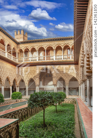 Main courtyard Patio de las Doncellas in Alcazar of Seville Spain. Mudejar architecture with arches and stone columns Main courtyard Patio de las Doncellas in Alcazar of Seville Spain. Mudejar architecture with arches and stone columns 142361850