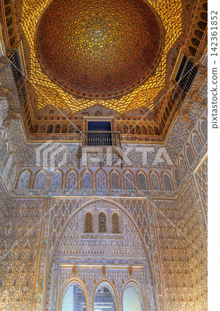 Ornate Mudejar ceiling and carved wall in Royal Alcazar of Seville Spain. Ancient Islamic geometric patterns in stone Ornate Mudejar ceiling and carved wall in Royal Alcazar of Seville Spain. Ancient Islamic geometric patterns in stone 142361852