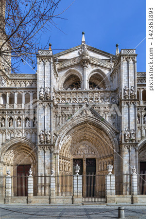 Portal of Toledo Cathedral in Spain, front view. Gothic stone carvings and religious sculptures in natural daylight Portal of Toledo Cathedral in Spain, front view. Gothic stone carvings and religious sculptures in natural daylight 142361893