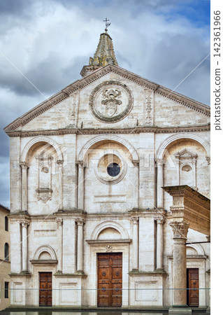 Duomo of Pienza Cathedral in Italy front facade view. Renaissance architecture under overcast cloudy sky Duomo of Pienza Cathedral in Italy front facade view. Renaissance architecture under overcast cloudy sky 142361966