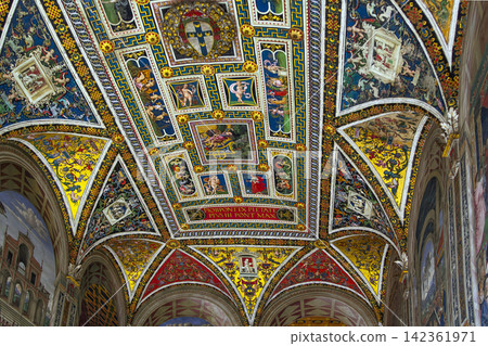 Piccolomini Library ceiling in Siena Cathedral Italy view of the vault. Renaissance frescoes with soft indoor lighting Piccolomini Library ceiling in Siena Cathedral Italy view of the vault. Renaissance frescoes with soft indoor lighting 142361971