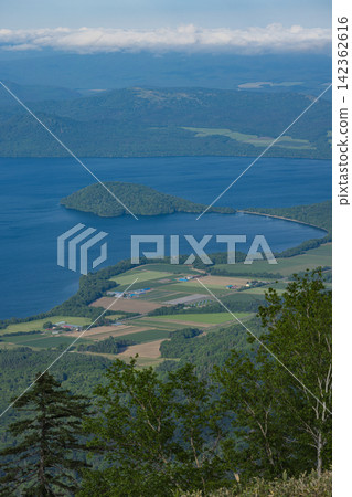 Lake Kussharo and Wakoto Peninsula as seen from the Tsubetsu Pass Observation Facility in Tsubetsu Town, Hokkaido, Japan Lake Kussharo and Wakoto Peninsula as seen from the Tsubetsu Pass Observation Facility in Tsubetsu Town, Hokkaido, Japan 142362616