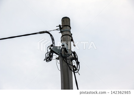 Communication Cables and Junction Box on Concrete Utility Pole Communication Cables and Junction Box on Concrete Utility Pole 142362985