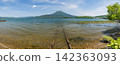 Japan, Hokkaido, Kushiro City: A view of Lake Akan in its fresh greenery, Mount Oakan, and the lakeside railway. 142363093