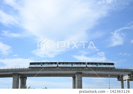 Linimo Aichi Rapid Transit 100 series train traveling on an elevated track Linimo Aichi Rapid Transit 100 series train traveling on an elevated track 142363126