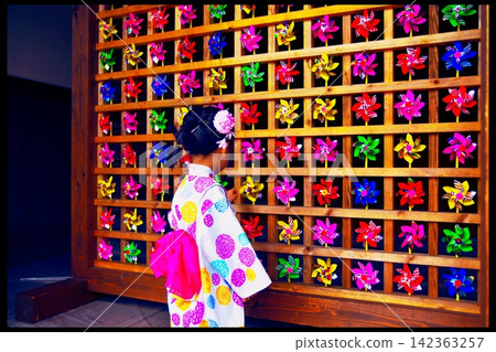 Windmill and a girl in a yukata Windmill and a girl in a yukata 142363257