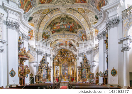 Interior of the church at Banz Abbey, Germany. View of the baroque nave with ornate columns. Bright indoor lighting 142363277