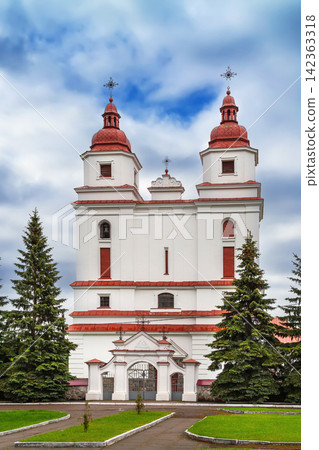 Transfiguration church complex in Vaverka, Belarus. Neoclassical architecture temple under partly cloudy dynamic sky Transfiguration church complex in Vaverka, Belarus. Neoclassical architecture temple under partly cloudy dynamic sky 142363318