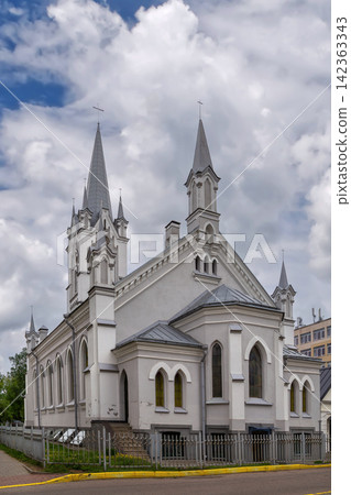 Apsidal view of Lutheran Church in Grodno, Belarus. Neo Gothic religious brick architecture landmark under daylight Apsidal view of Lutheran Church in Grodno, Belarus. Neo Gothic religious brick architecture landmark under daylight 142363343