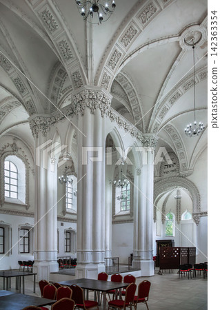 Interior of main hall in Great Choral Synagogue in Grodno, Belarus. Historic Jewish religious architecture in ambient light Interior of main hall in Great Choral Synagogue in Grodno, Belarus. Historic Jewish religious architecture in ambient light 142363354