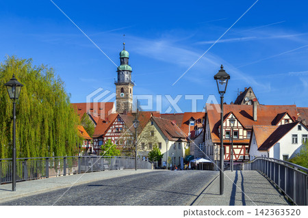 Scenic view of Lauf an der Pegnitz, Germany from a bridge. Historic old town architecture along the river at daytime Scenic view of Lauf an der Pegnitz, Germany from a bridge. Historic old town architecture along the river at daytime 142363520