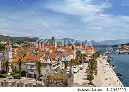 Wide panoramic view of Trogir and bay from Kamerlengo fortress, Croatia. Scenic coastal landscape under blue sky Wide panoramic view of Trogir and bay from Kamerlengo fortress, Croatia. Scenic coastal landscape under blue sky 142363533