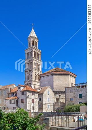 Cathedral of Saint Domnius view from back alley in Split, Croatia. Tall historic belfry under bright sunny sky 142363535