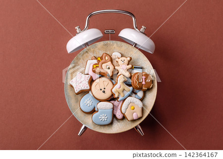 Gingerbread as a Christmas staple, sweet biscuits for the holiday. Gingerbread as a background Gingerbread as a Christmas staple, sweet biscuits for the holiday. Gingerbread as a background 142364167