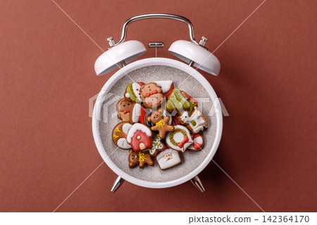 Gingerbread as a Christmas staple, sweet biscuits for the holiday. Gingerbread as a background Gingerbread as a Christmas staple, sweet biscuits for the holiday. Gingerbread as a background 142364170
