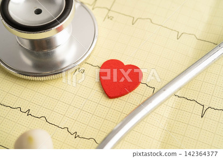 Stethoscope on electrocardiogram ECG, heart wave, heart attack, cardiogram report. Stethoscope on electrocardiogram ECG, heart wave, heart attack, cardiogram report. 142364377