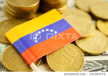 Venezuela flag on coin and banknote money, finance trading investment business currency concept. Venezuela flag on coin and banknote money, finance trading investment business currency concept. 142364378