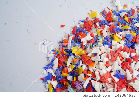Plastic colorful pieces recycling shredded for industrial use. Plastic colorful pieces recycling shredded for industrial use. 142364653