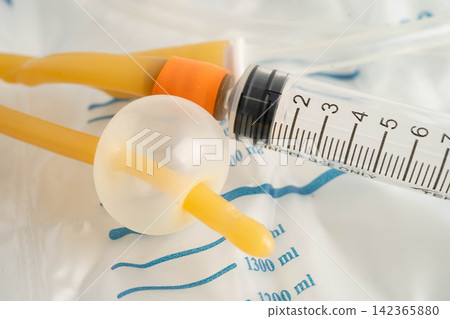 Foley catheter and urine drainage bag collect urine for disability or patient in hospital. Foley catheter and urine drainage bag collect urine for disability or patient in hospital. 142365880
